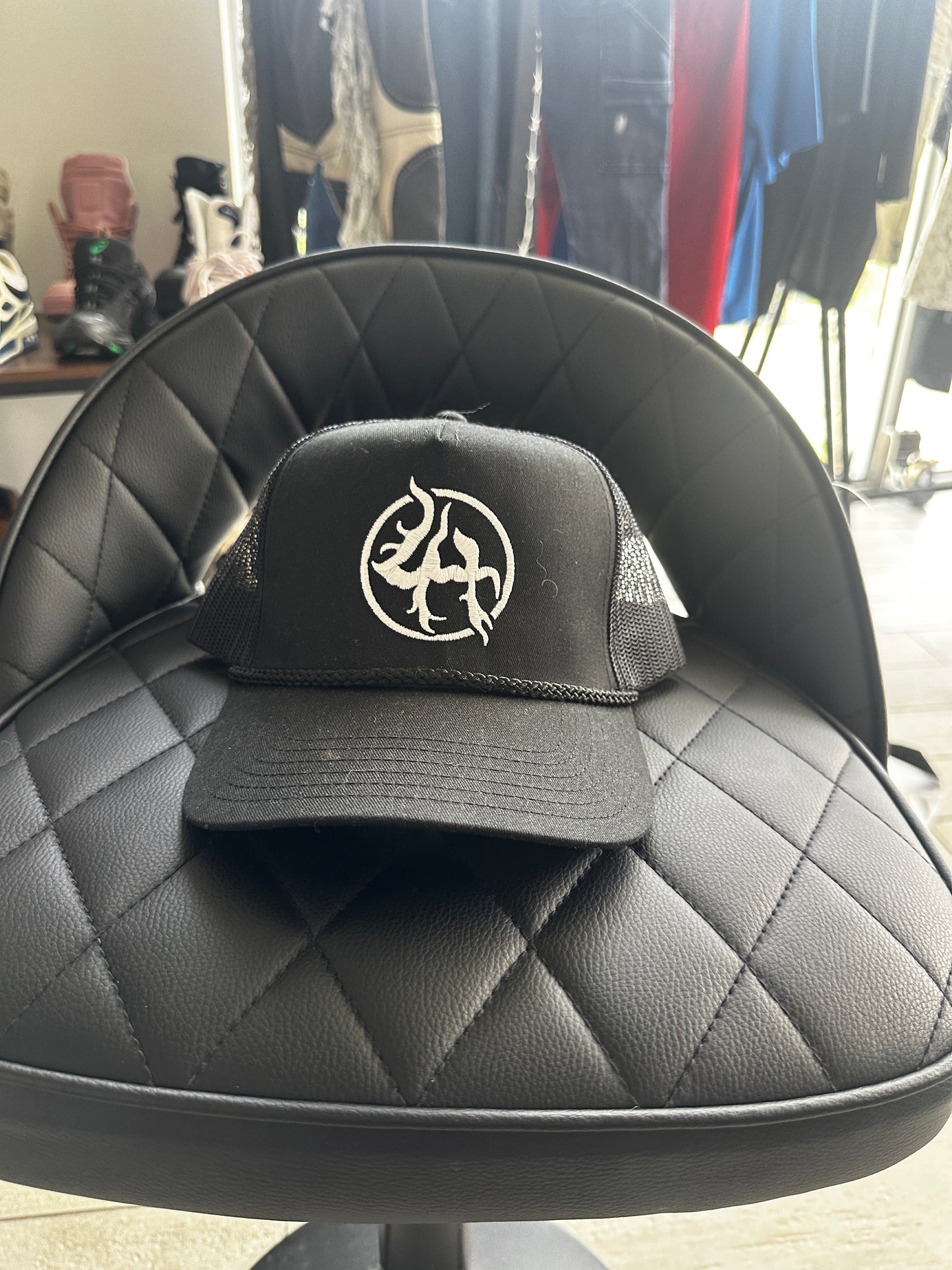 lack Trucker Hat with White Symbol Logo